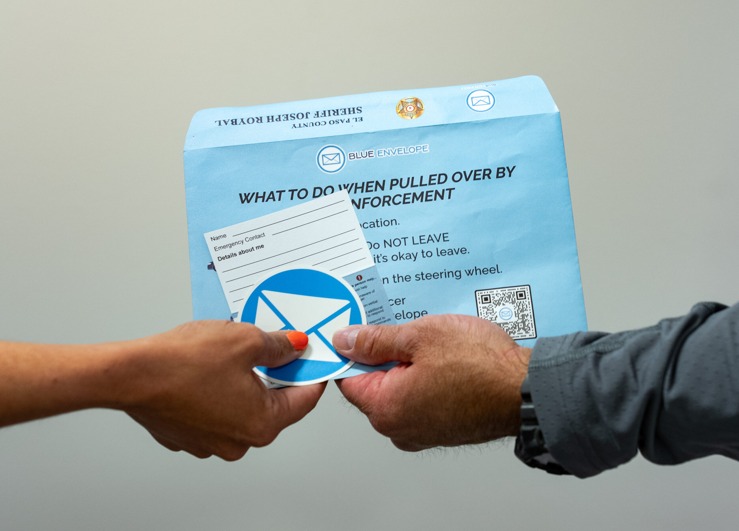 Blue Envelope Hand Off