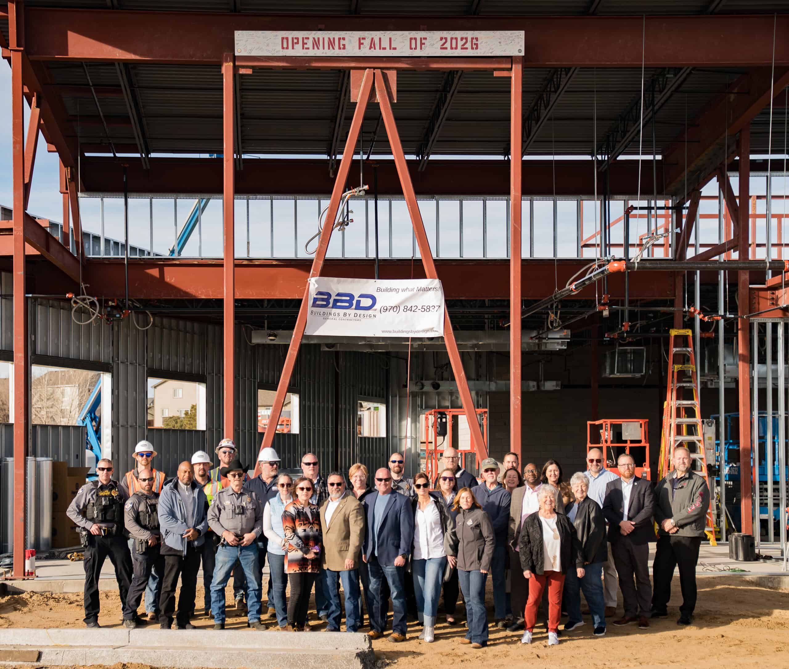 A photo of attendees after the truss has been added.